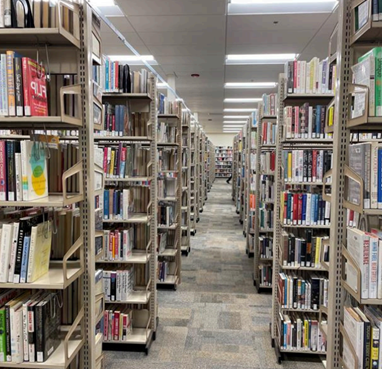 Rows and rows of tall shelving holding Modesto Library's books during the renovation